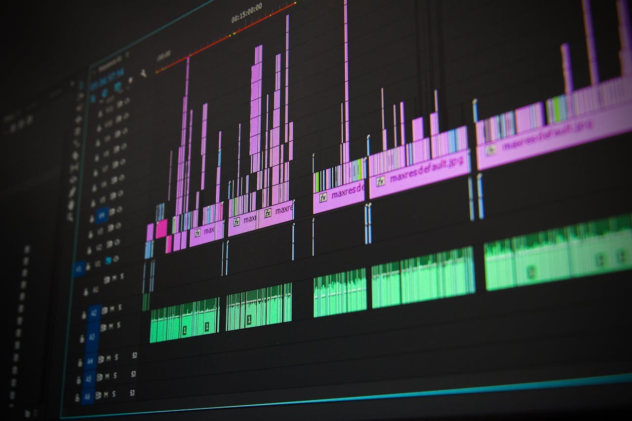 hero-img-02 Close-up of a professional audio and video editing software interface with waveform displays.